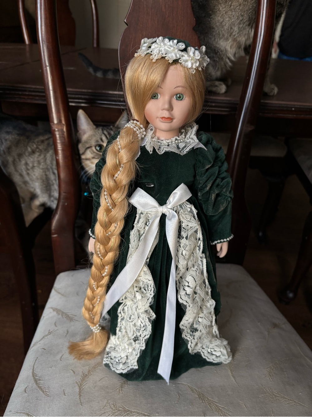 Green Lace-Trimmed Porcelain Doll with Long Blonde Braid